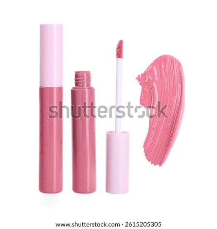 Tubes of lip gloss, applicator and sample isolated on white