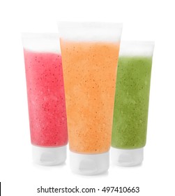 Tubes of natural scrub on white background