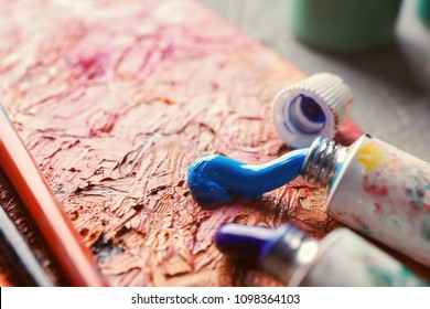 Tubes with paints on table, closeup