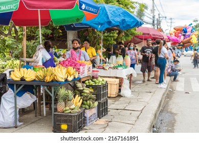 Tubigon, Bohol, Philippines - May 2022: A Temporary Fruit Stand Setup By The Sidewalk During The Town Fiesta.