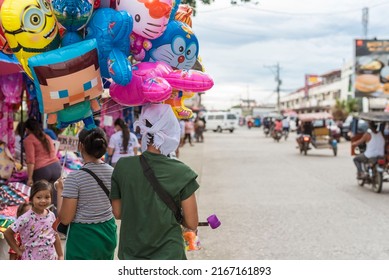 Tubigon, Bohol, Philippines - May 2022: A Vendor Selling Balloons Of Popular Characters During The Town Fiesta.