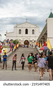 Tubigon, Bohol, Philippines - May 2022: A Bunch Of People Near St. Isidore The Farmer Church During The Town Fiesta.