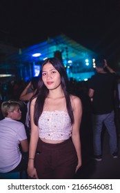 Tubigon, Bohol , Phillippines - May 2022: A Young Woman Enjoys An Outdoor Disco, A Popular Street Dance Party Usually Occurring At The Town Plaza The Night Of The Fiesta.