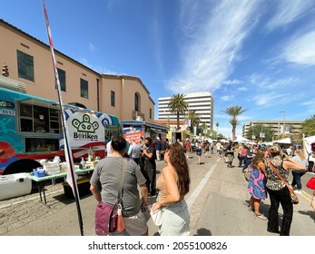 Tucson, Arizona, USA - October 8, 2021. People in line to sample a meal at ethnic food trucks at the annual Tucson Meet Yourself Festival. 