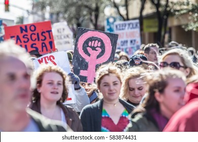 TUCSON, AZ - JANUARY 21: Selective focus view of woman holding pink female with fist sign at the Women's March on Washington January 21, 2017 in Tucson, AZ, USA.