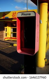 Tucumcari, New Mexico - June 14 2015:  An Empty Phone Booth By A Chinese Restaurant On Route 66.