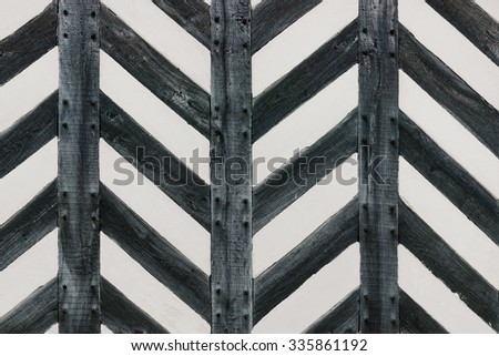Tudor house wall with half timber strong wood in zig zag shape feature