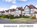 Tudor style detached houses on a suburban street in Hatch End, Harrow, London, UK