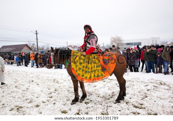 Tudora, Moldova, Romania 2020. On the first\
day of the year the New Year\'s party is celebrated in the commune\
of Tudora, the neighbors carry large cars, people disguised with\
animal masks,\
druids....