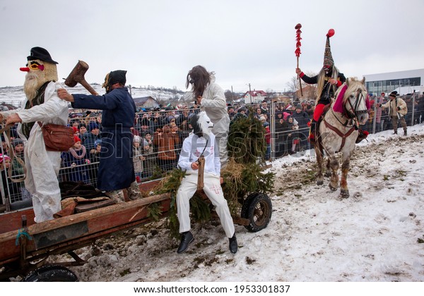 Tudora, Moldova, Romania 2020. On the first\
day of the year the New Year\'s party is celebrated in the commune\
of Tudora, the neighbors carry large cars, people disguised with\
animal masks,\
druids....