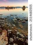 Tufa Towers At Sunrise Reflecting Into The Alkaline Waters of Mono Lake, South Lake Tufa Trail,  Mono Lake Tufa State Natural Reserve, Lee Vining, California, USA