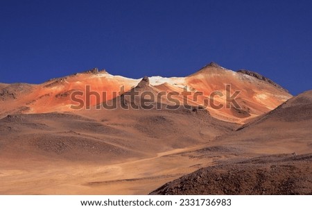 Tufted grass and volvano; Volcanic colors near Chilean border; Bolivia; Rocas de Dali abstract; Shadows and reflections at sunset; Bolivian Altiplano; Sunset over Valle de la Luna; Chile