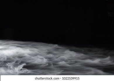 Tufts Of Hazy Smoke Made By Dry Ice On Black Background