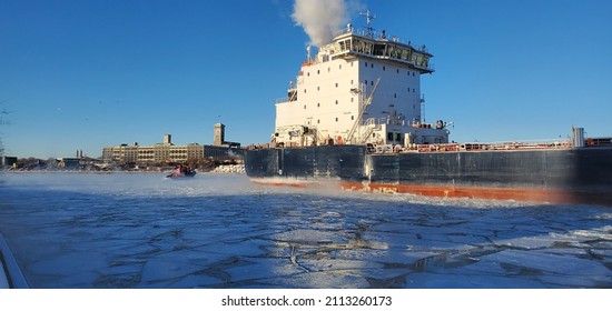 Tug Boat Breaking Up Ice In The Port