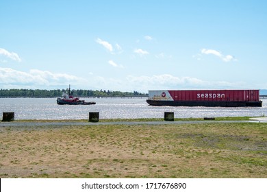 A Tug Boat Pulling A Barge.   Richmond BC Canada   April 25th 2020
