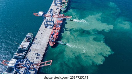 Tug boat pulling Cargo container ship go to international yard port. technology freight shipping with smart port. Cargo ship at logistic warehouse.