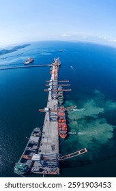 Tug boat pulling Cargo container ship go to international yard port. technology freight shipping with smart port. Cargo ship at logistic warehouse.