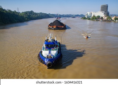 Tug Boat Pulling Coal Barge On Mahakam River, Samarinda