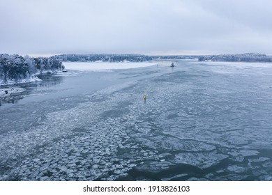 Tug Boat Pushing Through The Ice On A Sea In Winter