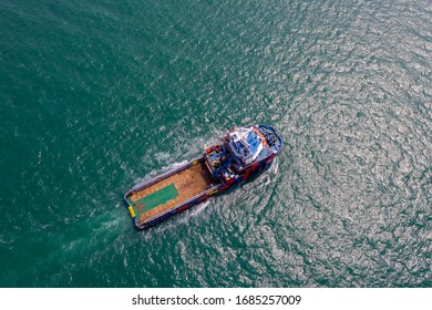 tug boat sailing on the green sea aerial view from drone - Shutterstock ID 1685257009