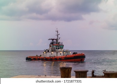 Tug Boat Side View In Malta At Sunset