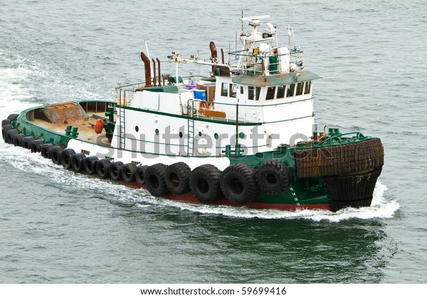 Tug Boat Traveling Through Water Stock Photo (Edit Now) 59699416