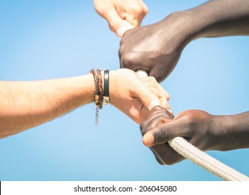 Tug Of War - Concept Of Interracial Multi Ethnic Union Together Against Racism - Multiracial Hands Teamwork