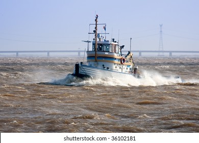 Tugboat Crossing The Storm, At His Way To The Safe Harbor