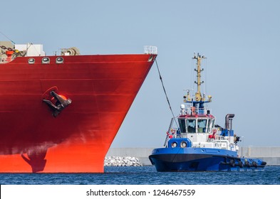 TUGBOAT AND SHIP - Ships maneuver in the port