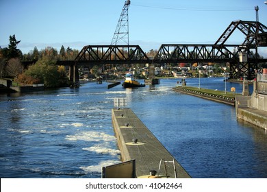 A Tugboat Waits For Its Turn At The Ballard Locks In Seattle Washington