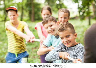 Tug-of-war in park - Powered by Shutterstock