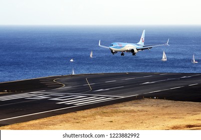 TUI Boeing 737. The Commercial Jet Aeroplane Started The Landing Gear System For Landing.. Airport Funchal, Madeira, Portugal. Atlantic Ocean. August 12, 2018.