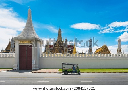 Tuk Tuk car on the road ,outside  Wat Phra Sri Rattana Satsadaram,Bangkok Thailand,outside scenery,Temple Architecture    