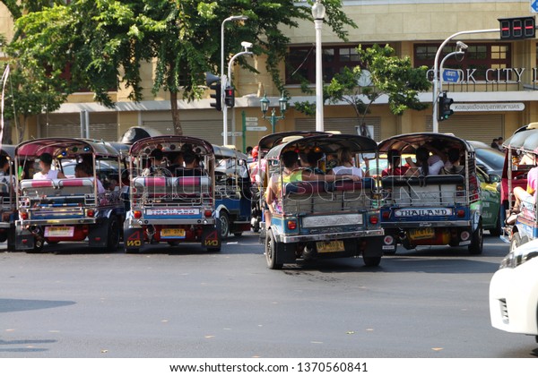Tuk tuk taxi\
and passengers going to Khao san road for Songkran festival.\
Bangkok, Thailand. 13 April\
2019