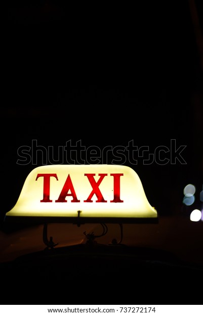 Tuk Tuk\
taxi waiting for passengers on the\
street.