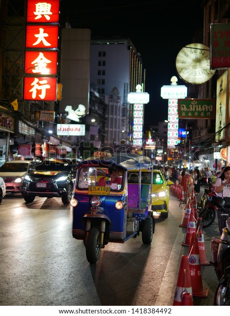 tuktuk three wheel taxi in bangkok thailand\
driving in china town at night 18 may\
2019