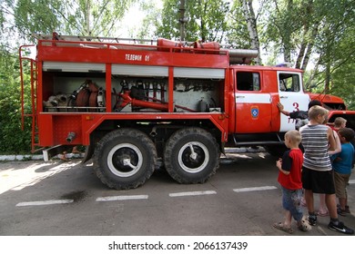 Tula, Tula Region, Russia - 03.07.2013: Red Fire Truck And Children. Firefighters. Risky Work. Danger. Safety. Rescue Service. Fire Drills At Summer Camp. Help. 911