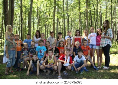 Tula, Tula Region, Russia - 07.23.2012: Counselors And Children At A Summer Camp. Children's Recreation. Fun. Summer Camp Activities. Group Portrait. Friendship