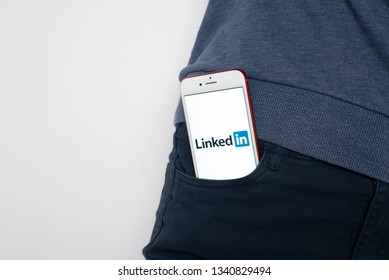 Tula, Russia, March 12, 2019: Linkedin on Apple iPhone 8 screen in jeans pocket. Linkedin app icon. linkedin.com. Social media app. Social network - Image