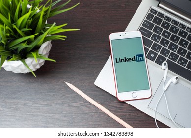 Tula, Russia, March 12, 2019: Linkedin logo on the iphone screen is placed on the laptop keyboard. - Image