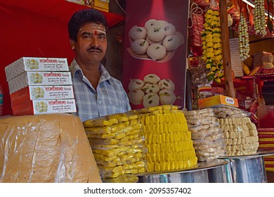 Tulajapur, India- December 19th 2019; Stock Photo Of 40 To 50 Year Old Indian Man Wearing Casual Cloths Selling Fresh Milk Made Sweets , Dessert, And Snacks Near Temple Area At Tulajapur, Maharashtra.