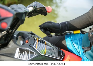 Tula/Russia - AUGUST 12, 2019
Man's Hand Holds A Jet Ski Ignition Key. 