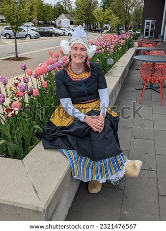Tulip Time Festival Volendam Dutch Dance Costume tour guide in Holland Michigan with colorful tulips and wooden shoes called Klompen