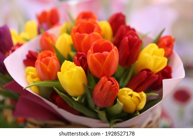 Tulip, tulips bouquet. Present for March 8, International Women's Day. Holiday decor with flowers. Bouquet with colorful tulips. Red tulip, yellow tulip. Holiday floral decor. Spring tulips, bouquet