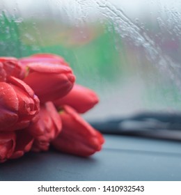 Tulips On Car Window. The First Date. First Love Concept.