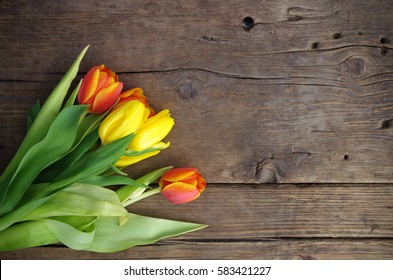 tulips on wooden vintage background, Mother's Day design concept 