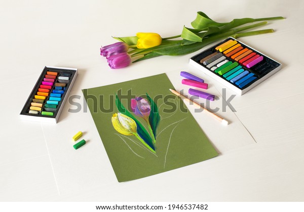 Tulip\'s picture with fresh tulips. Soft\
pastel drawing, painting of flowers. Top\
view
