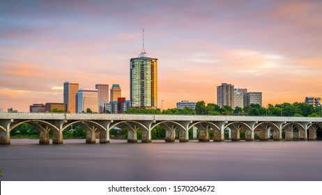 Tulsa, Oklahoma, USA downtown skyline on the Arkansas River at dusk.
