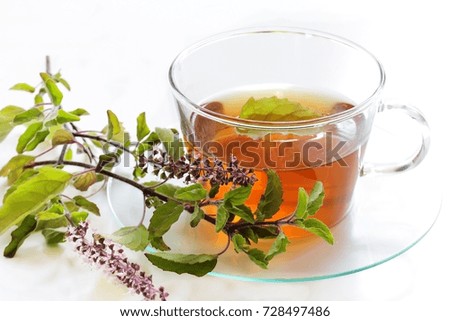 Similar – Cup with acacia blossoms Tea with spoon and honey