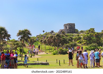 Tulum, Mexico - 07.22.2013: Tourists Walking Between Mayan Ruins At Tulum, The Site Of A Pre-Columbian Mayan Walled City On Caribbean Coastline In Mexican Riviera Maya, Quintana Roo, Yucatan, Mexico.